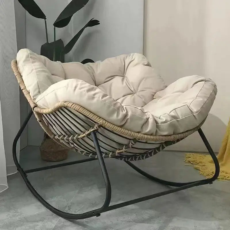 The Papasan rocking chair is suitable for outdoor use. This all-weather wicker Papasan patio chaircomeswithcushions and pillows.