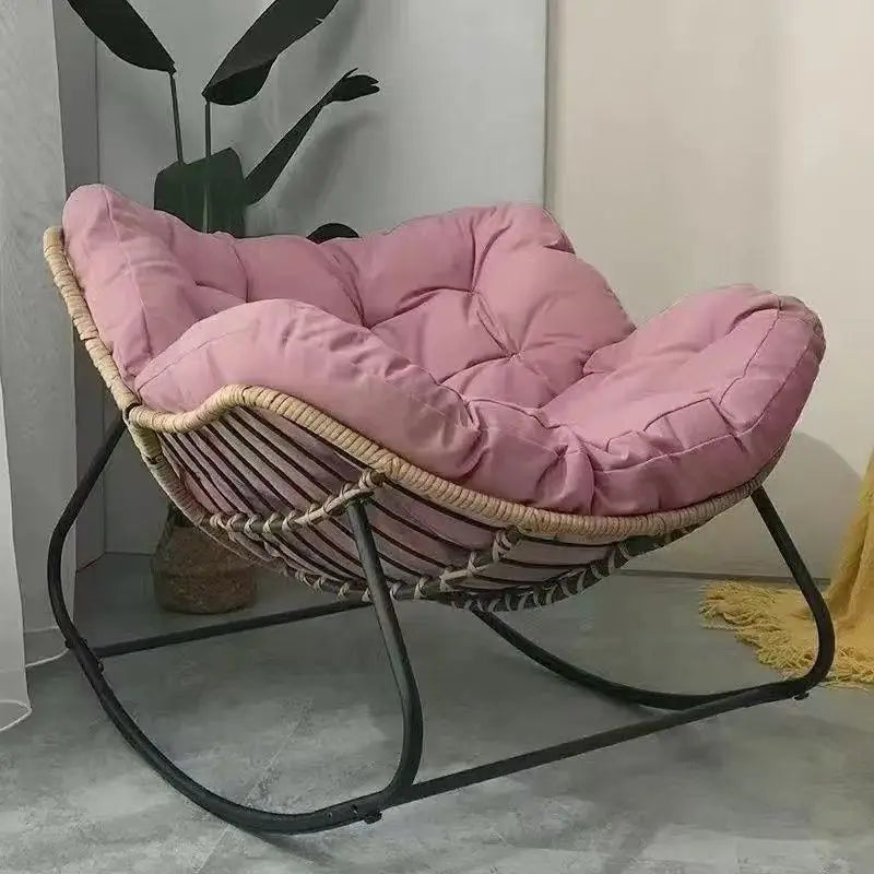 The Papasan rocking chair is suitable for outdoor use. This all-weather wicker Papasan patio chaircomeswithcushions and pillows.